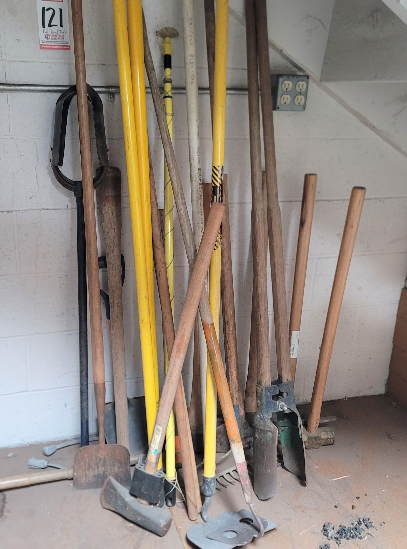 LOT - ALL HAND TOOLS UNDER STAIRWELL, TO INCLUDE: (2) SLEDGEHAMMERS, PICKAXES, AX, POST HOLE DIGGERS