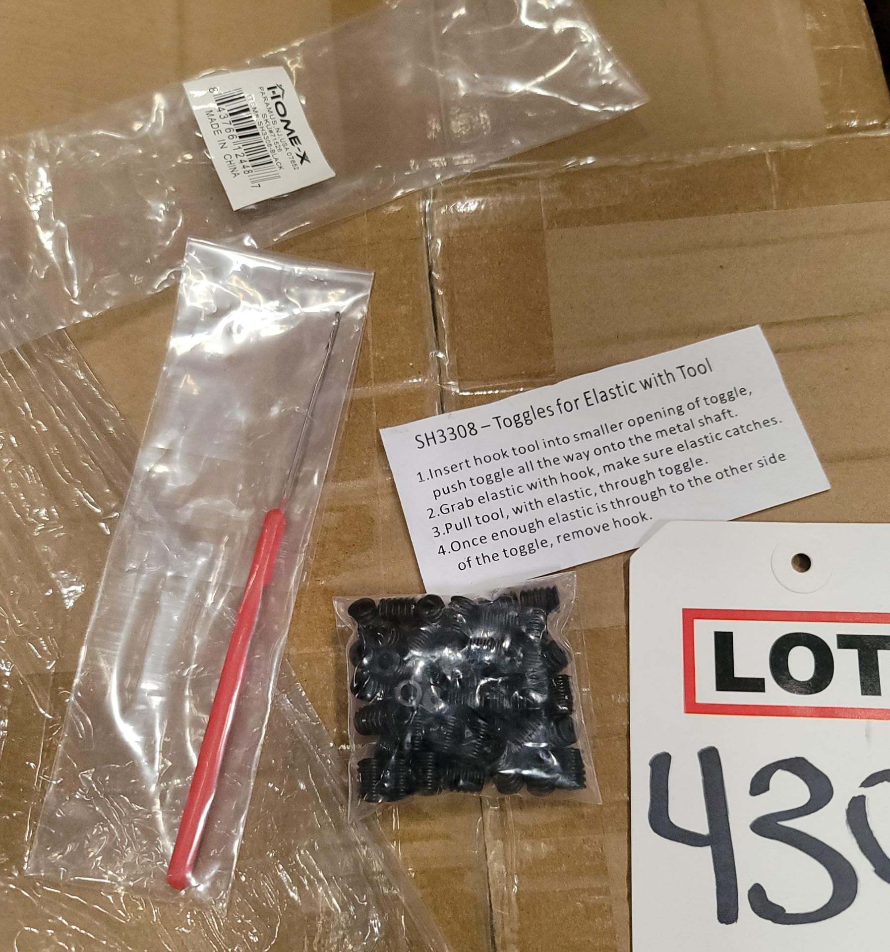 LOT - PALLET OF (2,700) BAGS OF TOGGLES W/ TOOL/SILICONE CORD LOCKS, (18 CASES/150 PER CASE)