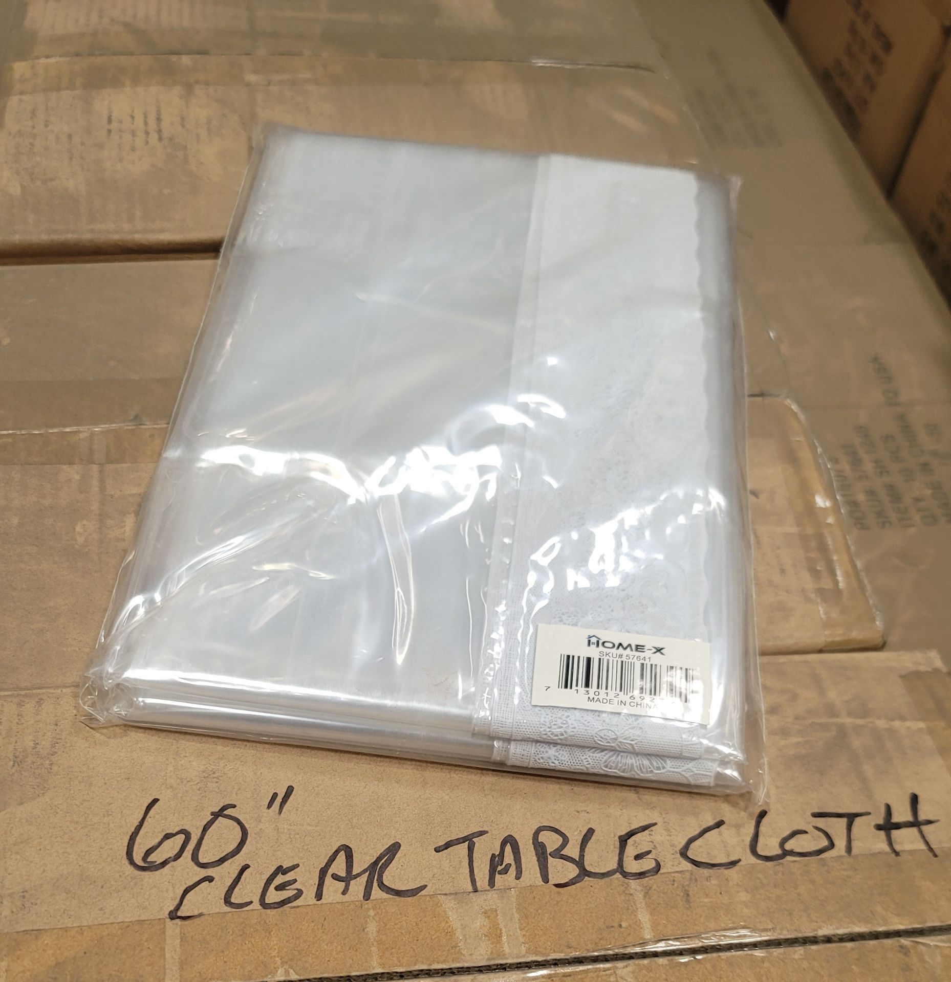 LOT - PALLET OF (300) 60" X 72" CLEAR PLASTIC TABLE COVER W/ FLORAL DESIGN BORDER, (30 CASES/10