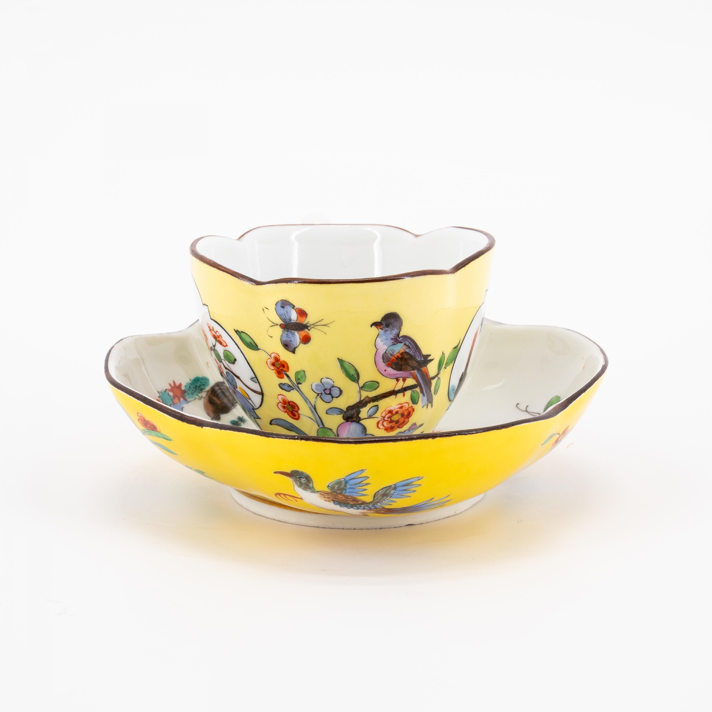 A PORCELAIN CUP AND THREE SAUCERS WITH YELLOW GROUND AND BIRD AND ROCK DECORATION - Image 6 of 8