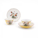 TWO PORCELAIN TEA BOWLS AND TWO SAUCERS WITH YELLOW GROUND AND KAKIEMON