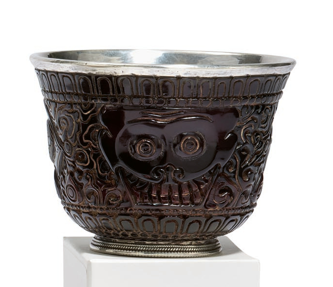 AMBER RITUAL VESSEL WITH FACES AND ORNAMENTAL DECORATION