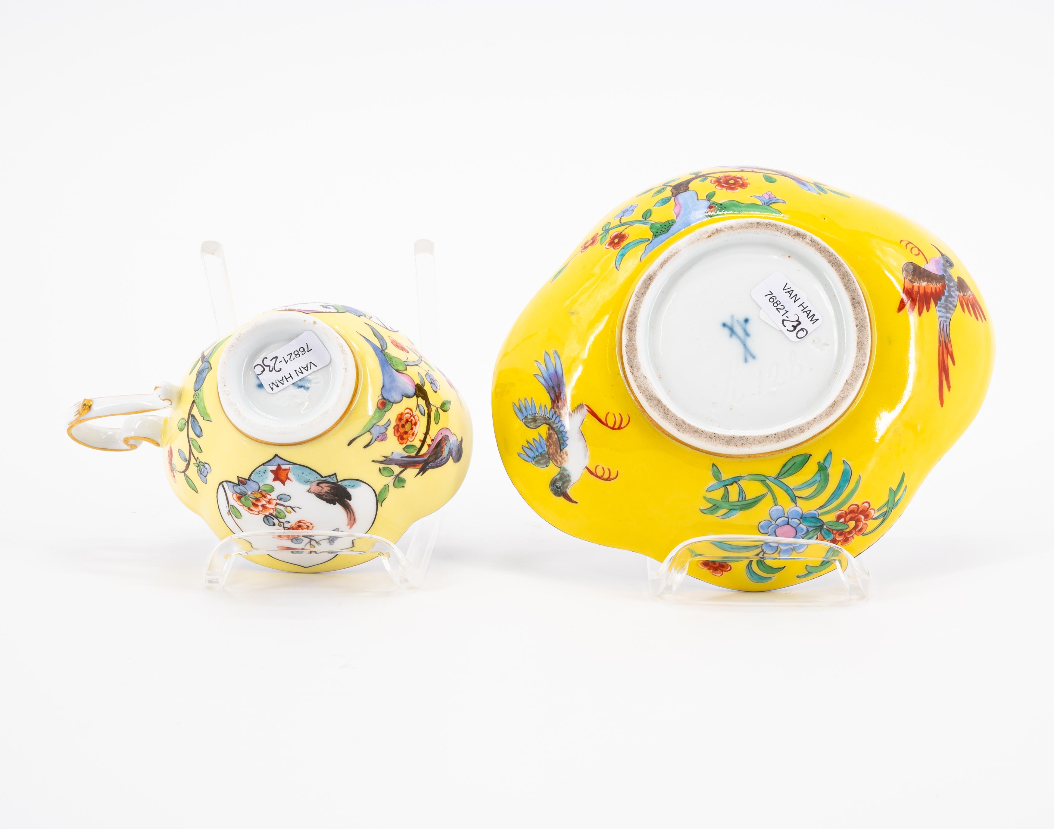 A PORCELAIN CUP AND THREE SAUCERS WITH YELLOW GROUND AND BIRD AND ROCK DECORATION - Image 8 of 8