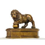 SMALL BRONZE SCULPTURE OF A LION ON A PEDESTAL