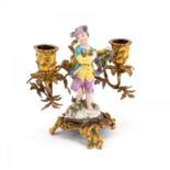 SMALL BRONZE AND PORCELAIN CANDLESTICK WITH WINEGROWER'S BOY