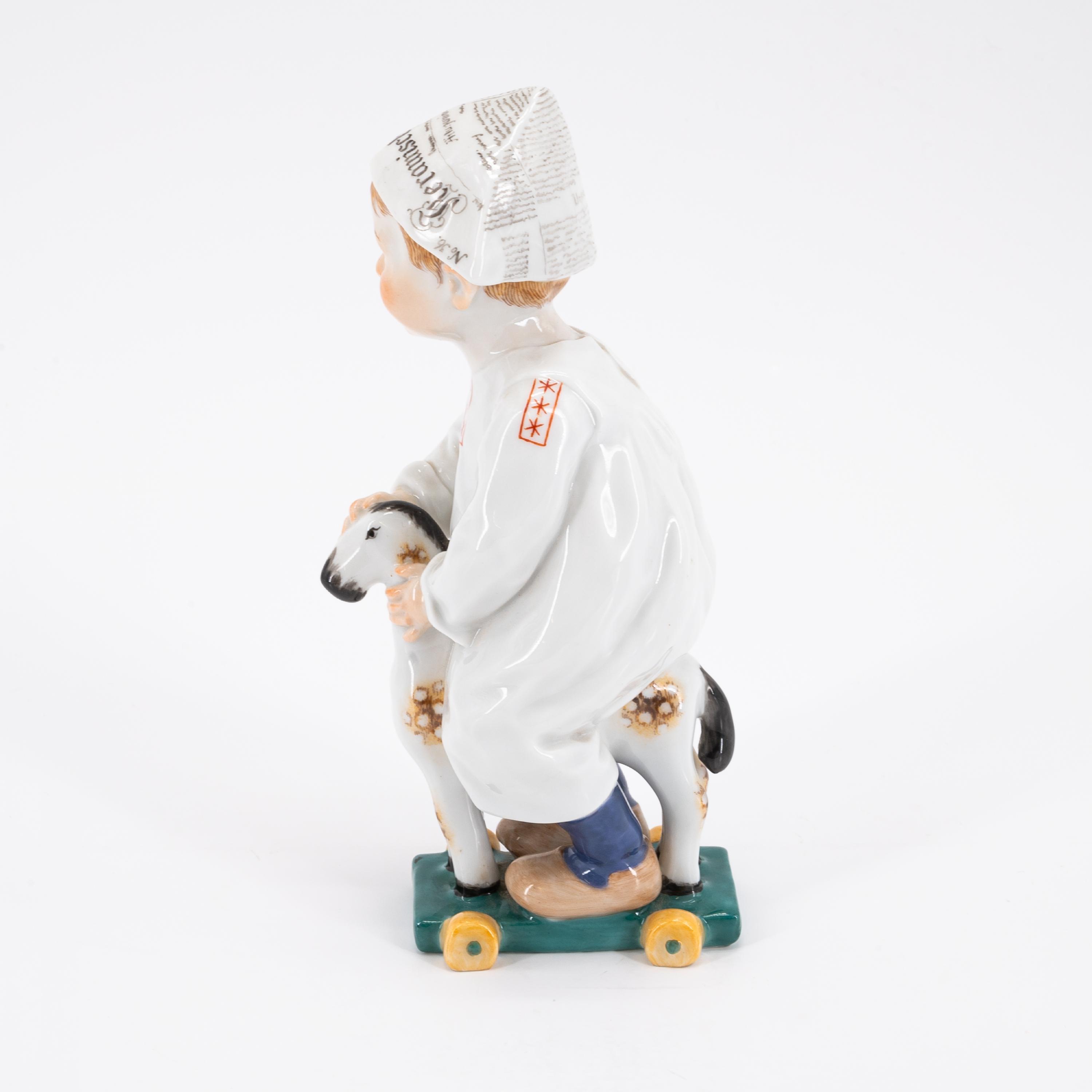 SMALL PORCELAIN BOY WITH NEWSPAPER HAT ON A LITTLE WOODEN HORSE - Image 2 of 5