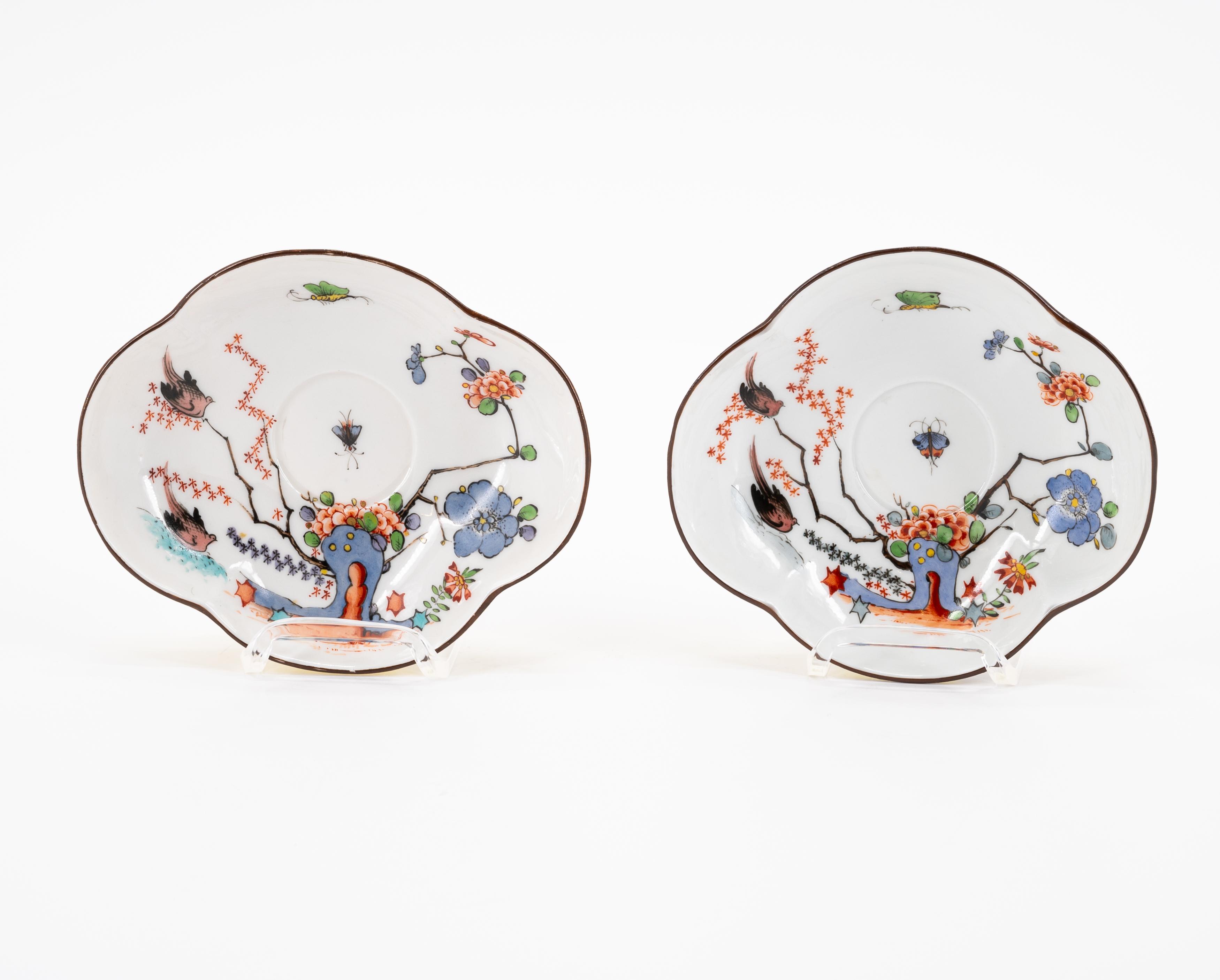 A PORCELAIN CUP AND THREE SAUCERS WITH YELLOW GROUND AND BIRD AND ROCK DECORATION - Image 2 of 8