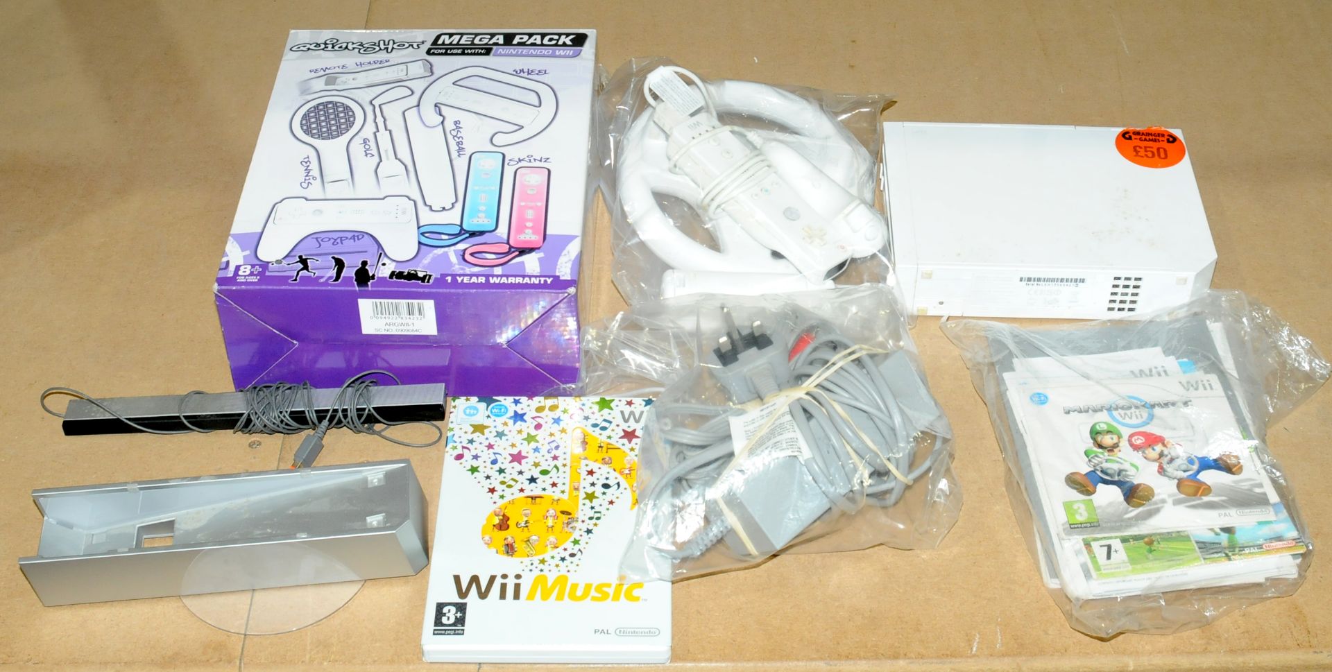 an unboxed Wii console along with accessories