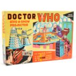 Chad Valley Doctor Who Projector which is red plastic with 16 colour slides
