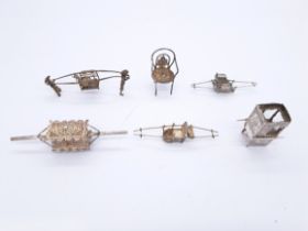 Collection of miniature silver and metal sedan chairs