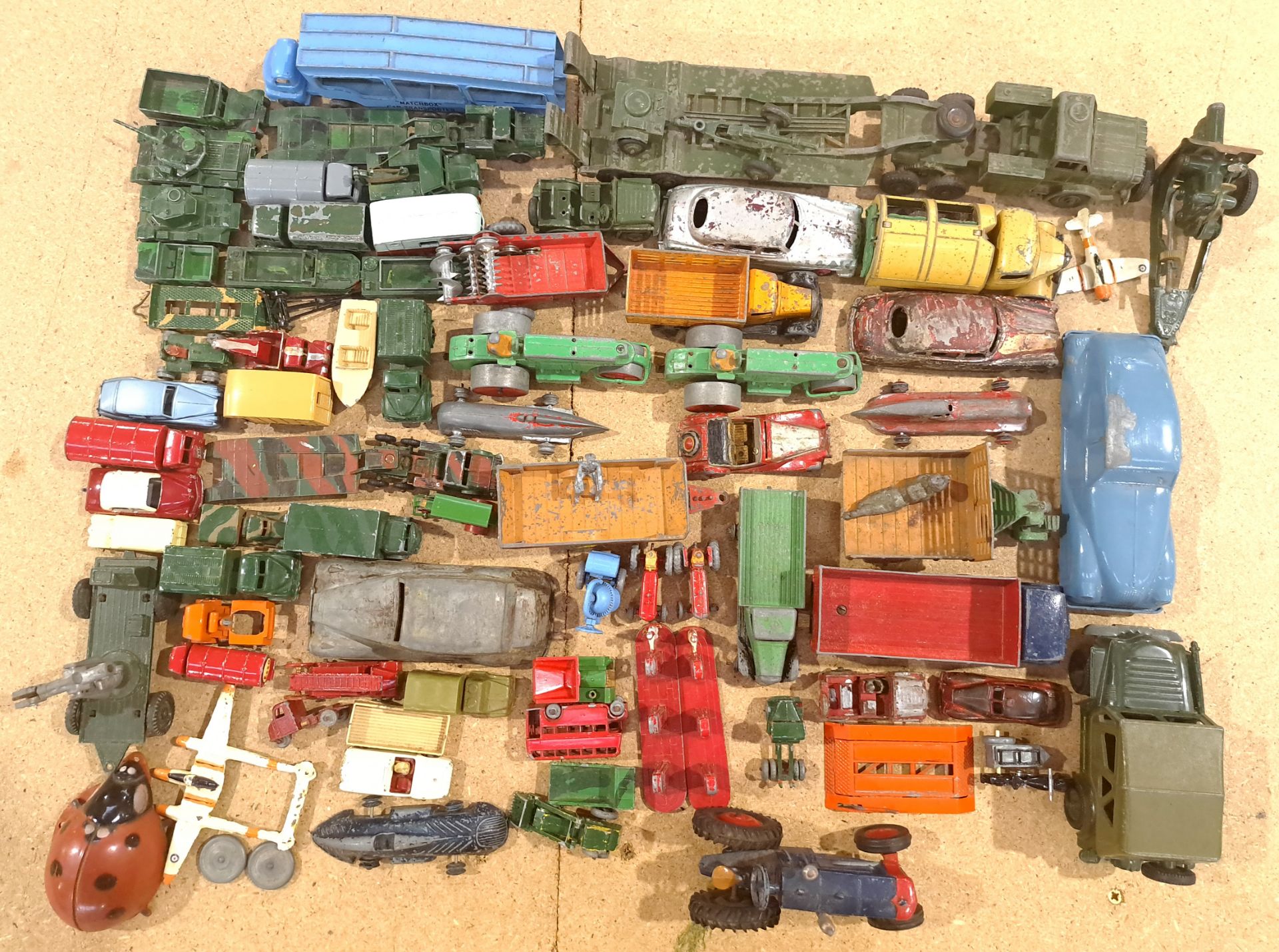Matchbox, Dinky, Britains and similar, a mixed unboxed group of vehicles. Conditions generally ap...