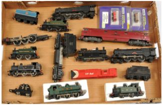 Triang, Peco & Similar a boxed and unboxed group of Locomotives, rolling stock and spare parts to...