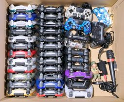 Large quantity of games console controllers