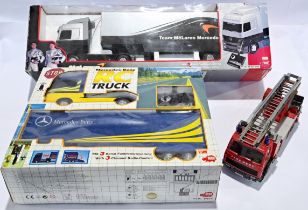 Dickie Spielzeug, a boxed radio controlled truck pair & fire engine.