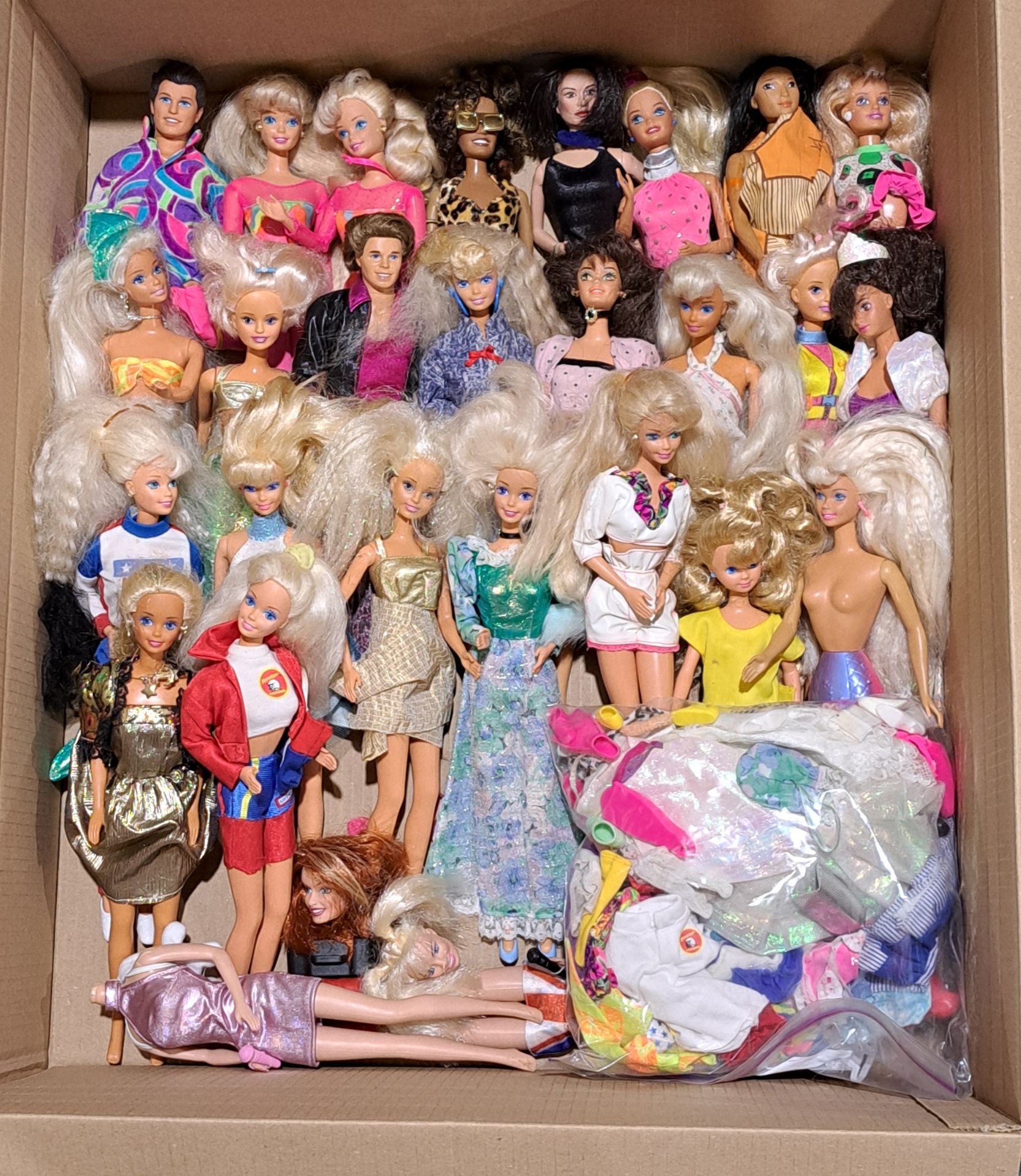 Barbie collection of vintage dolls plus assorted clothing
