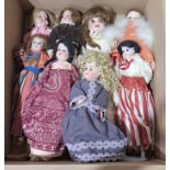 Assortment of vintage bisque dolls, including Armand Marseille