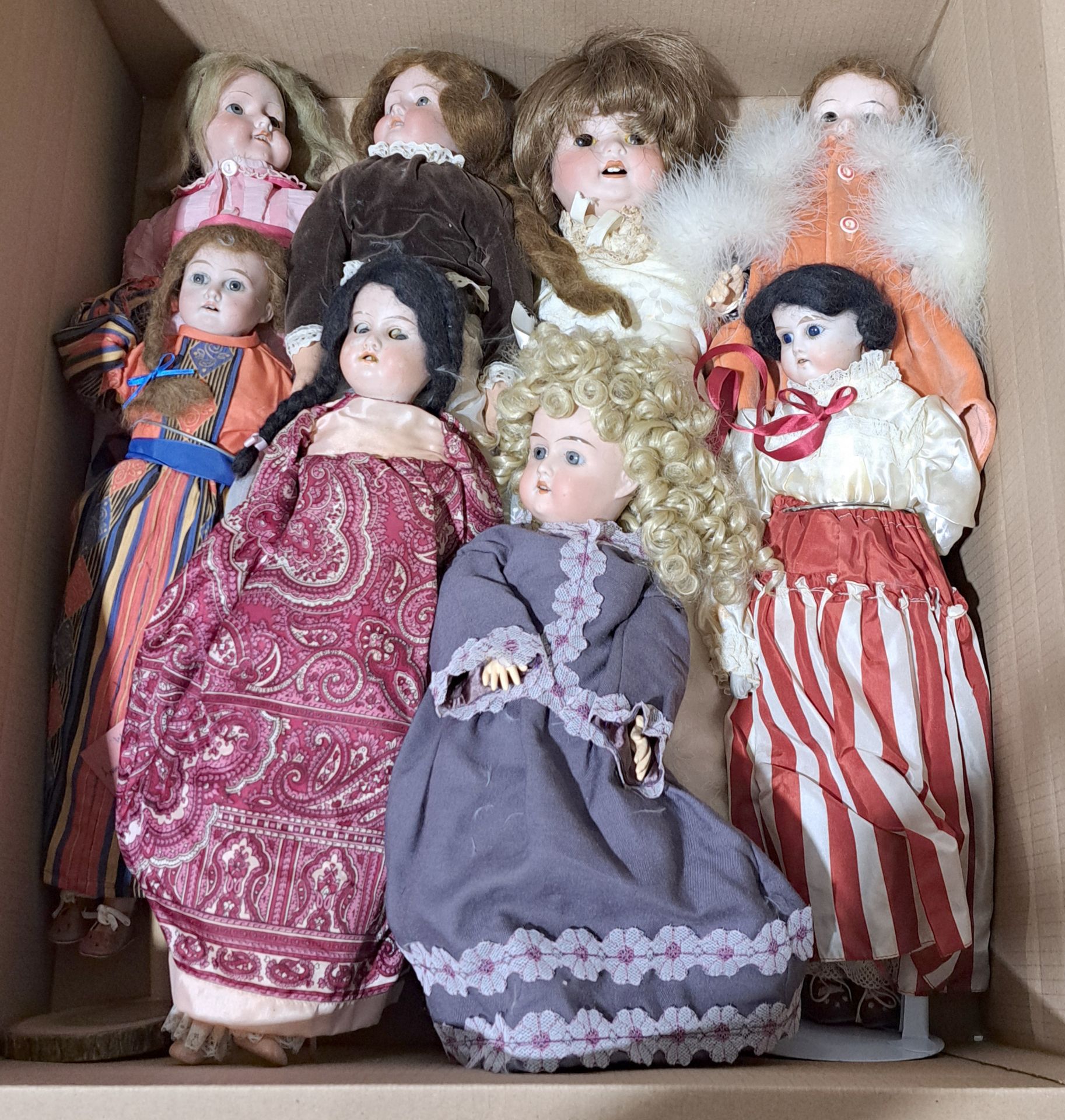 Assortment of vintage bisque dolls, including Armand Marseille