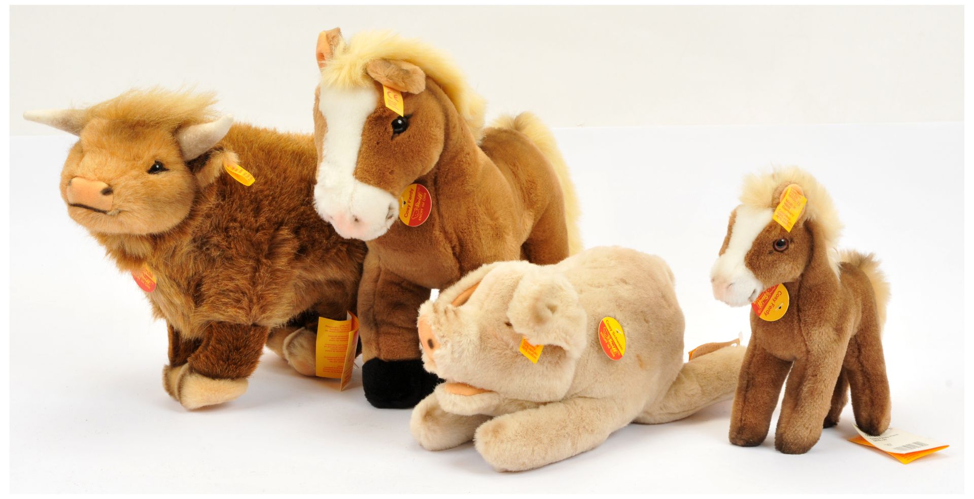 Steiff group of plush animals, including Highland Cow