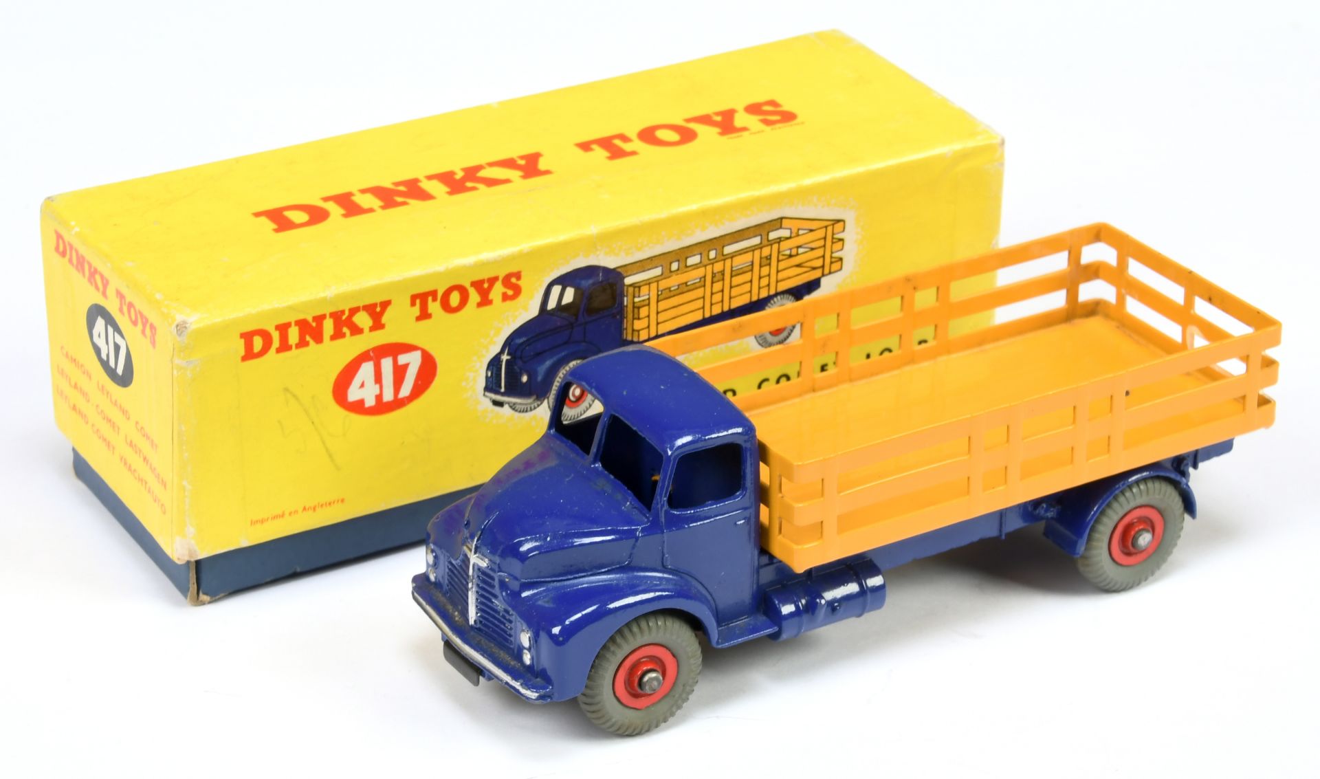 Dinky Toys 417 Leyland Comet Lorry - Violet blue cab and chassis, deep yellow stake back, red sup...