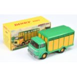 French Dinky Toys 577 Berliet Cattle Truck - Green, yellow including concave hubs, brown base and...