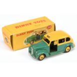 Dinky 254 Austin "Taxi" Two-Tone Green and Yellow including rigid hubs, black base and interior, ...