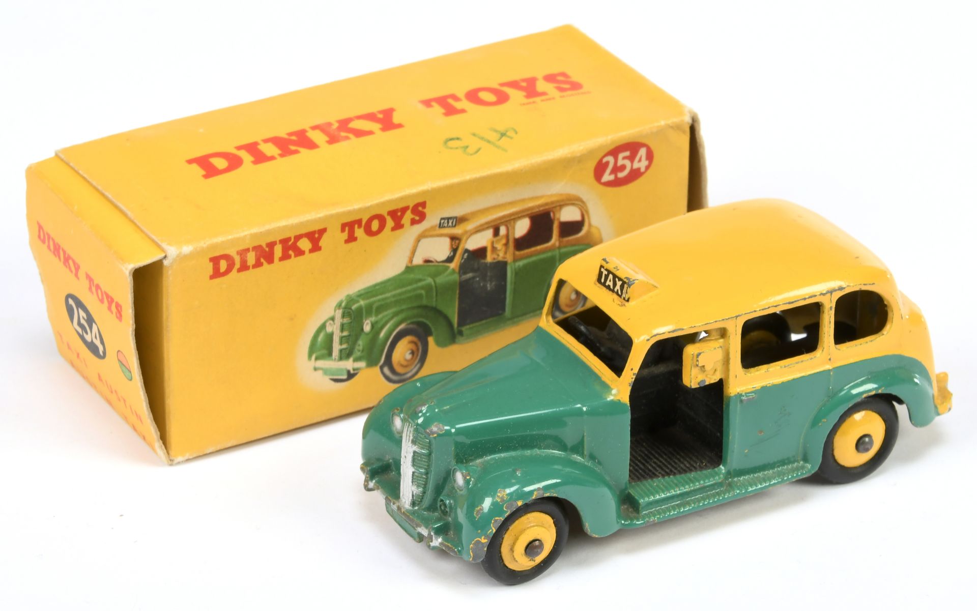 Dinky 254 Austin "Taxi" Two-Tone Green and Yellow including rigid hubs, black base and interior, ...