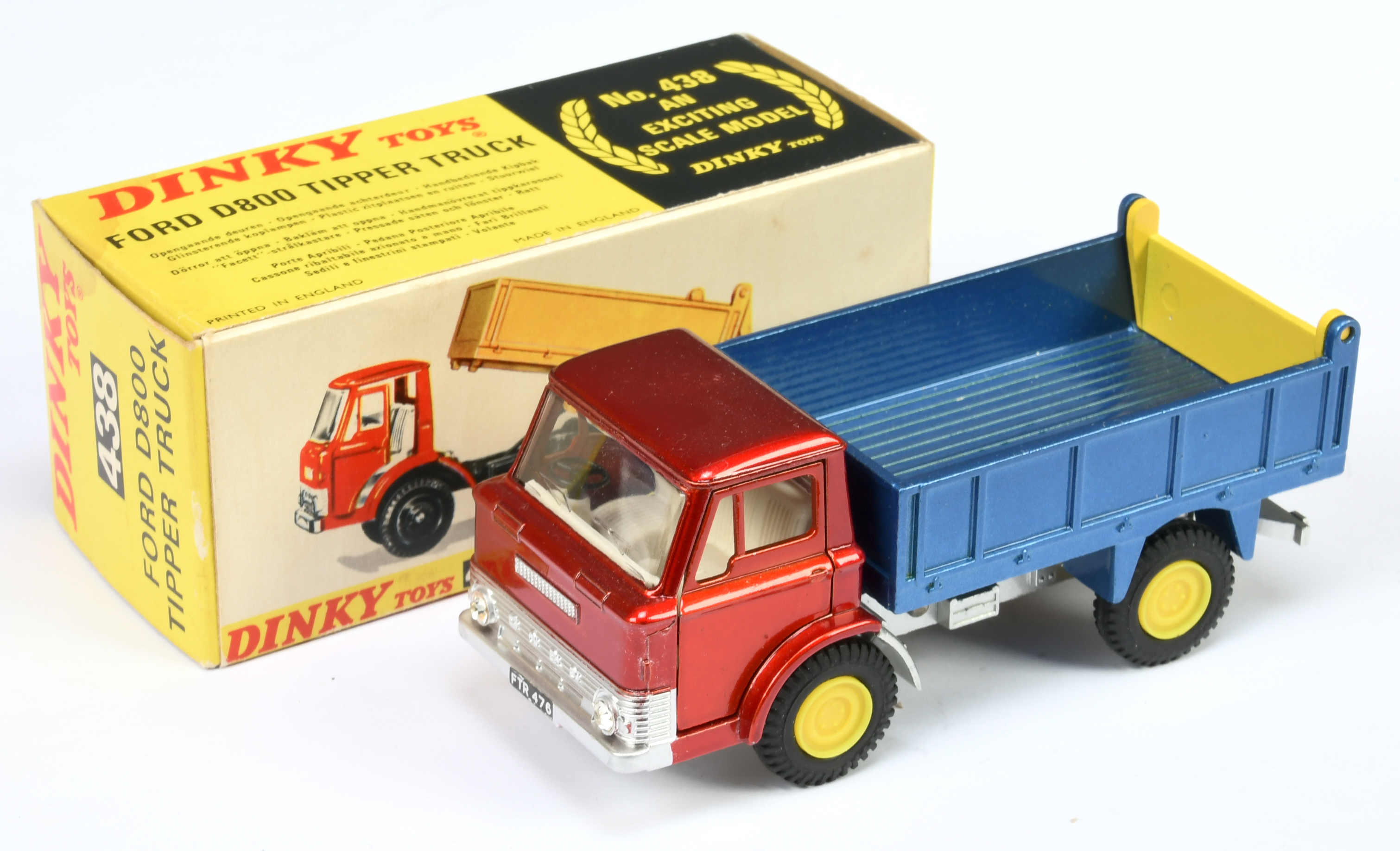 Dinky Toys 438 Ford D800 Tipper Truck - Metallic red cab, dark blue back, silver chassis, white i...