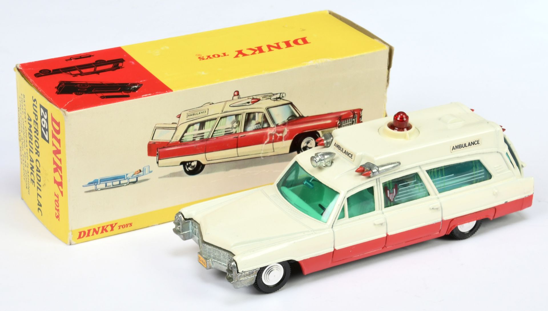 Dinky Toys 267 superior Cadillac "Ambulance" - White body, red lower sides, green tinted windows,...