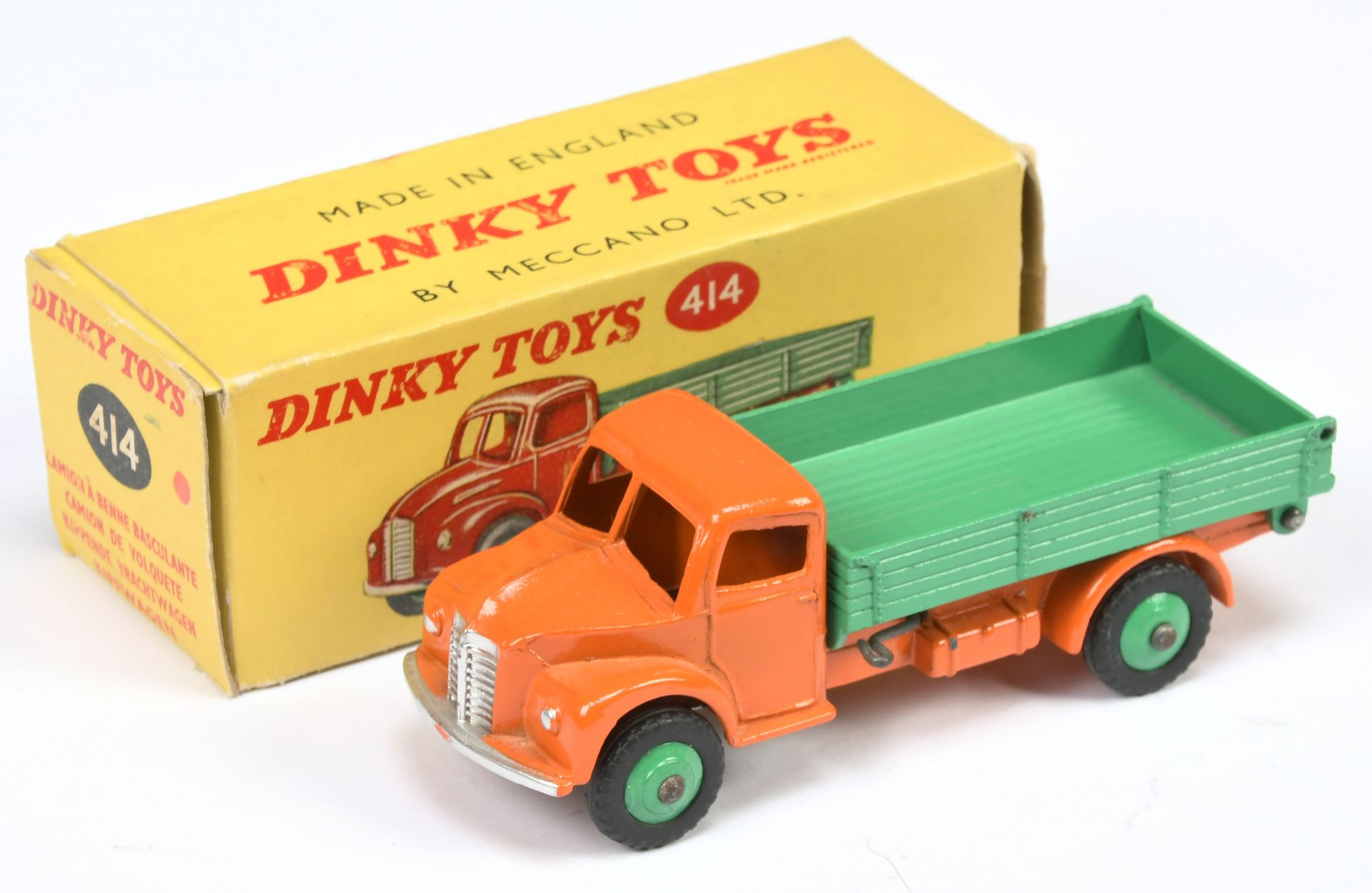 Dinky Toys 414 Dodge Tipping Wagon - Orange cab and  chassis, mid-green tipper and rigid hubs wit...