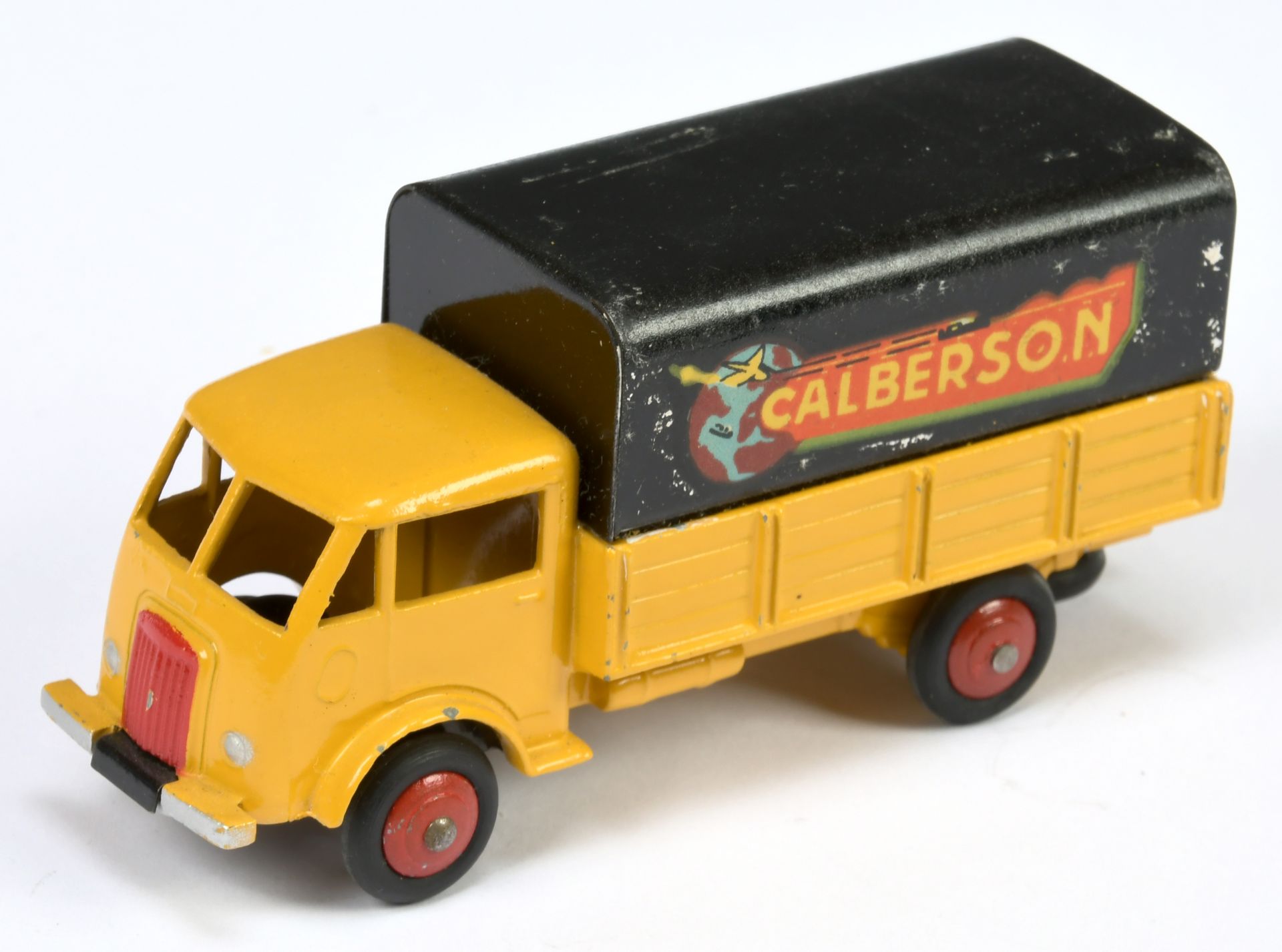 French Dinky Toys 25J Ford covered Truck " Calberson" - Yellow cab and back, black metal tilt and...