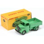 Dinky Toys 411 (25W)  Bedford Open back Truck - Mid-green body, chassis, back and rigid hubs with...