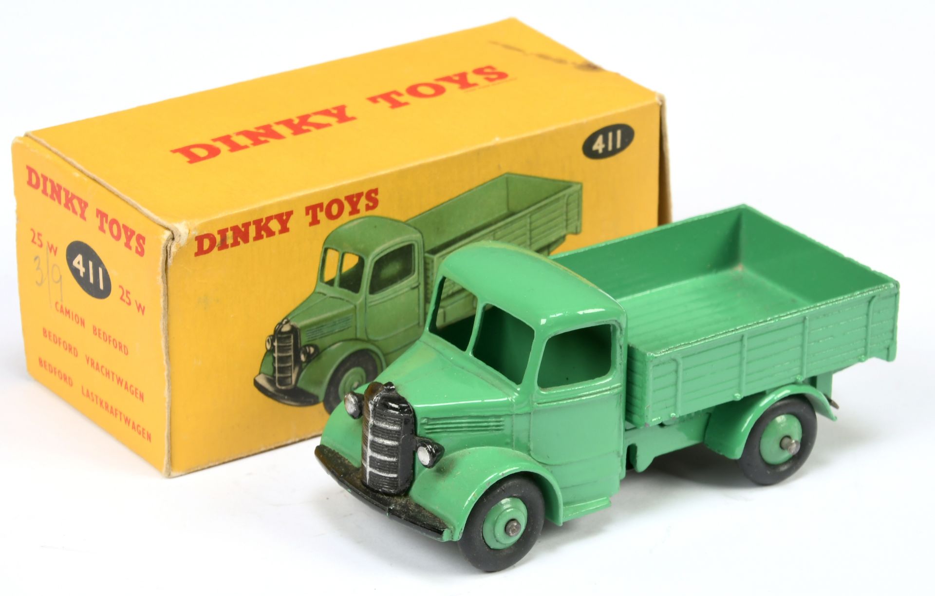 Dinky Toys 411 (25W)  Bedford Open back Truck - Mid-green body, chassis, back and rigid hubs with...