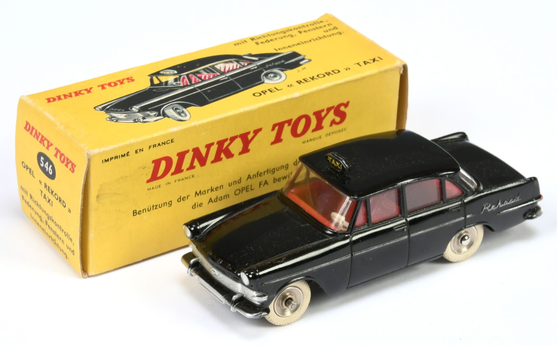 French Dinky Toys 546 Opel Rekord "Taxi" - Black body and roof box, red interior, silver trim ans...