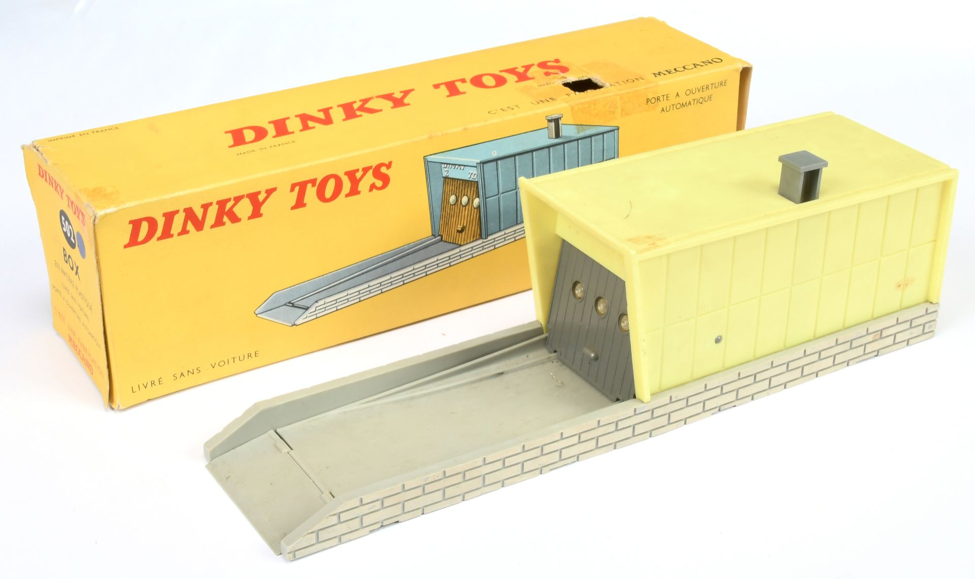 French Dinky Toys 502 Garage - Plastic issue grey base and opening door, with bright yellow garage 