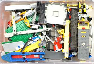 Lego a large unboxed quantity of loose items to include various colour parts, part built models, ...