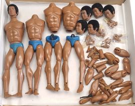 Hasbro Action Man a group of vintage 'Tom Stone' body parts including heads, hands, arms, part-bo...