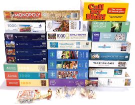 A quantity of jigsaw puzzles & board games