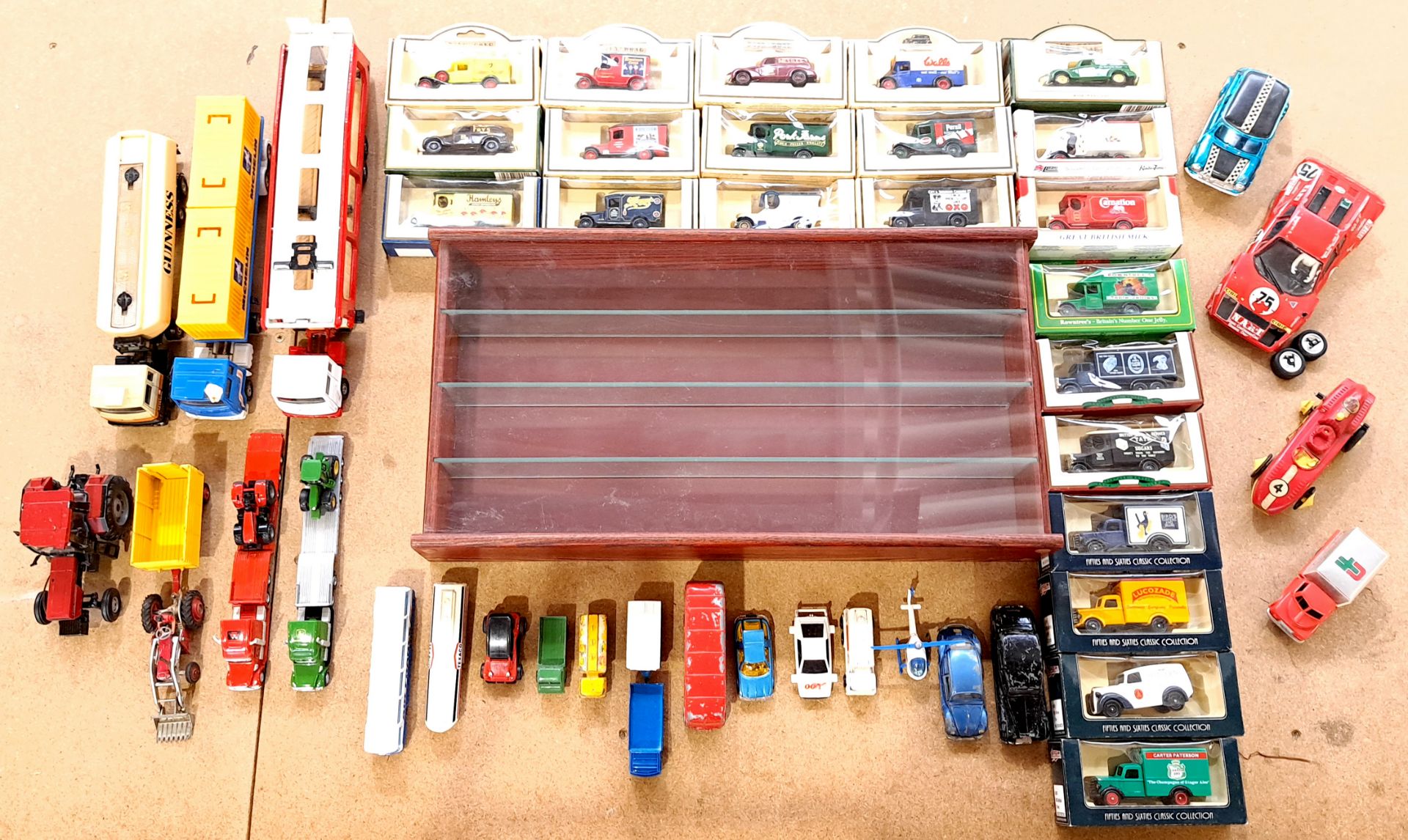 Lledo, Corgi, Dinky & similar, a boxed & unboxed vehicle group plus wall mountable cabinet
