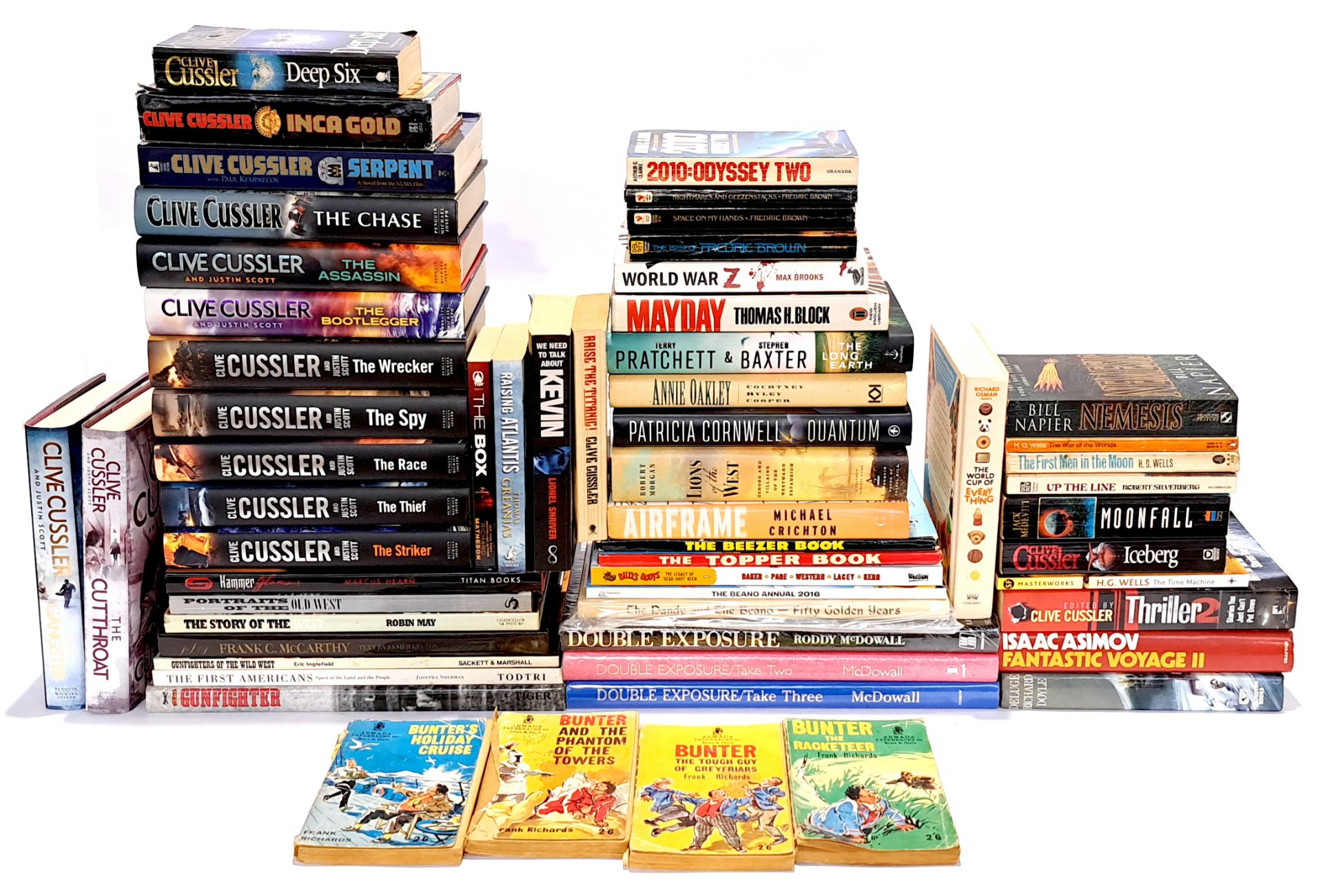 A large quantity of mixed themed hardback and paperback books and novels