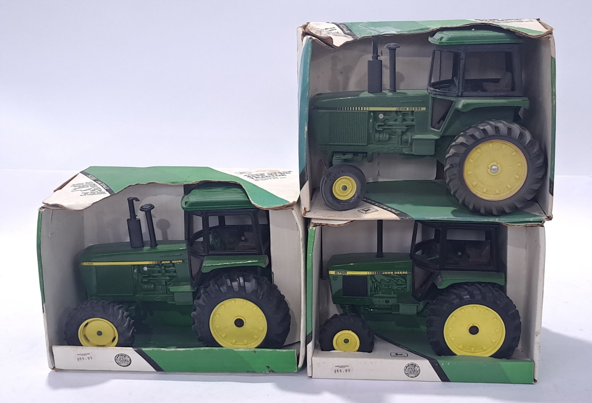 ERTL, a John Deere Tractor group to include #5579, 5584 and similar. Conditions generally appear ...