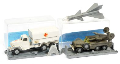 FJ Military a pair - (1) Rocket firing lorry - drab green with silver-grey rocket  (2) Covered lo...