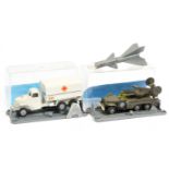 FJ Military a pair - (1) Rocket firing lorry - drab green with silver-grey rocket  (2) Covered lo...