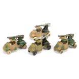 Tootsietoy group of 4 Mack trucks with guns  - (1) Camouflage ta/green bare metal hubs with, whit...