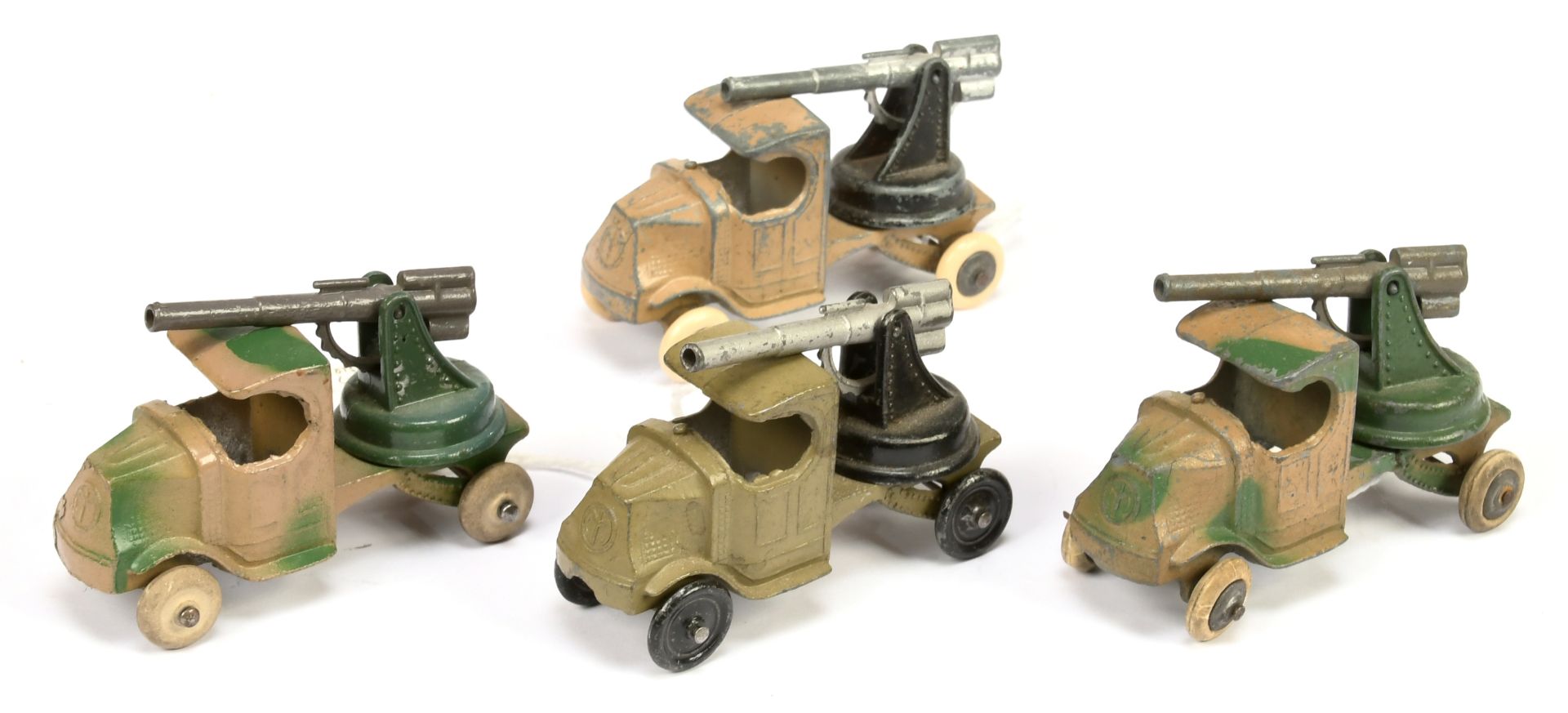 Tootsietoy group of 4 Mack trucks with guns  - (1) Camouflage ta/green bare metal hubs with, whit...