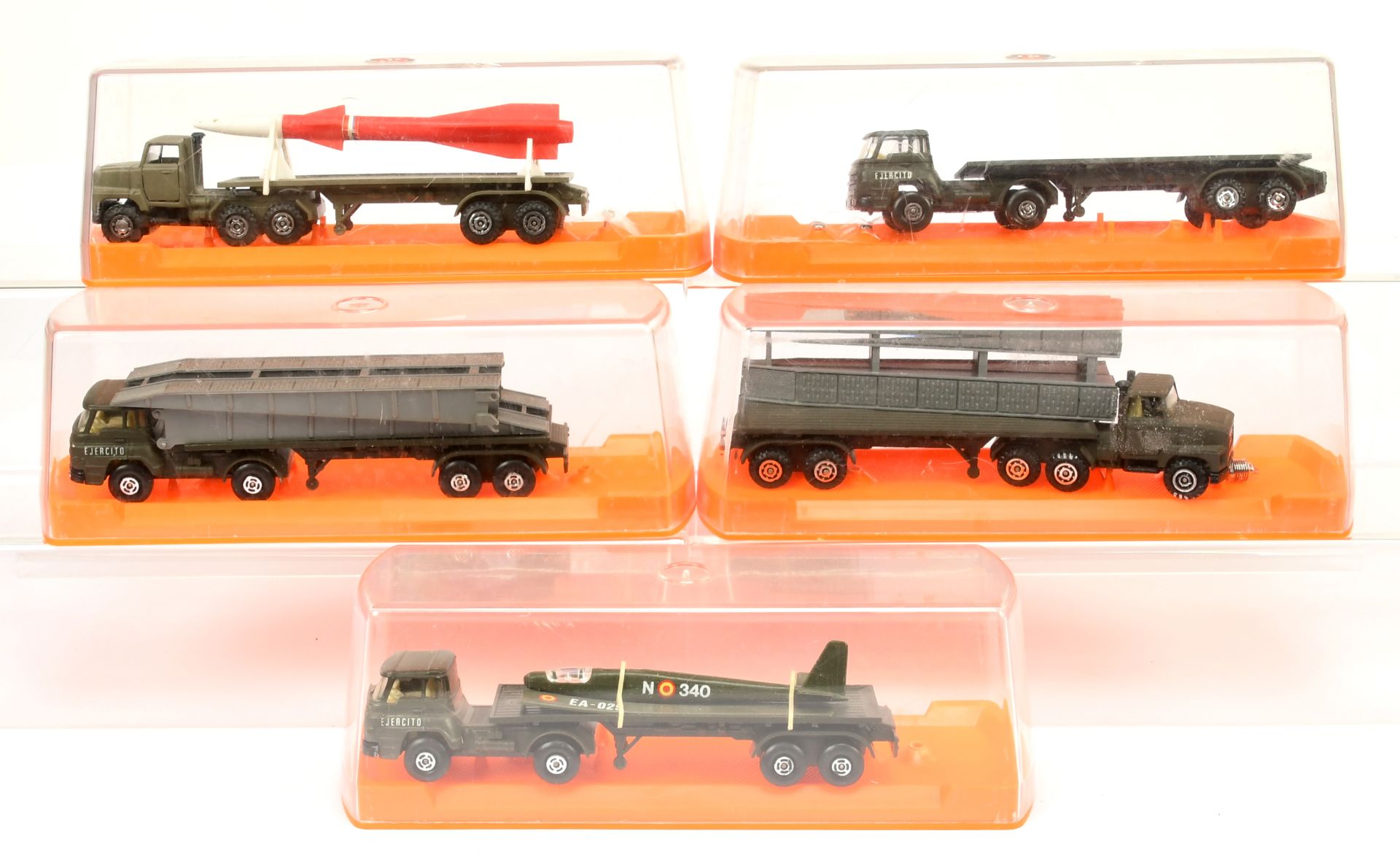 Guiloy Military group of 5  trucks with trailers to include -, Rocket launcher, Bridge layer truc...