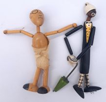 Pair of vintage wooden articulated figures, including Gandhi