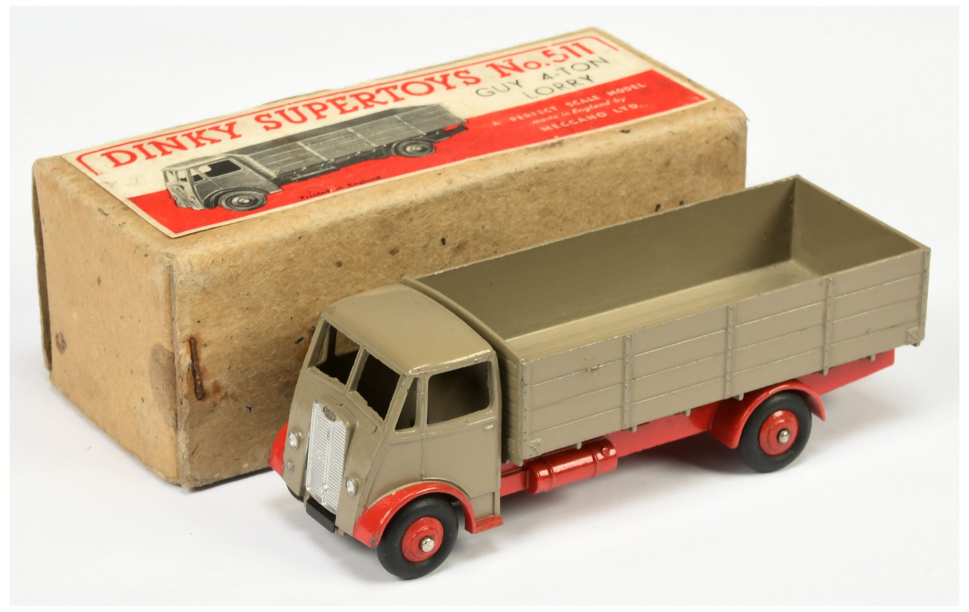 Dinky toys 511 Guy (type 1) 4-Ton Lorry Fawn cab and back, red chassis and rigid hubs, silver tri...