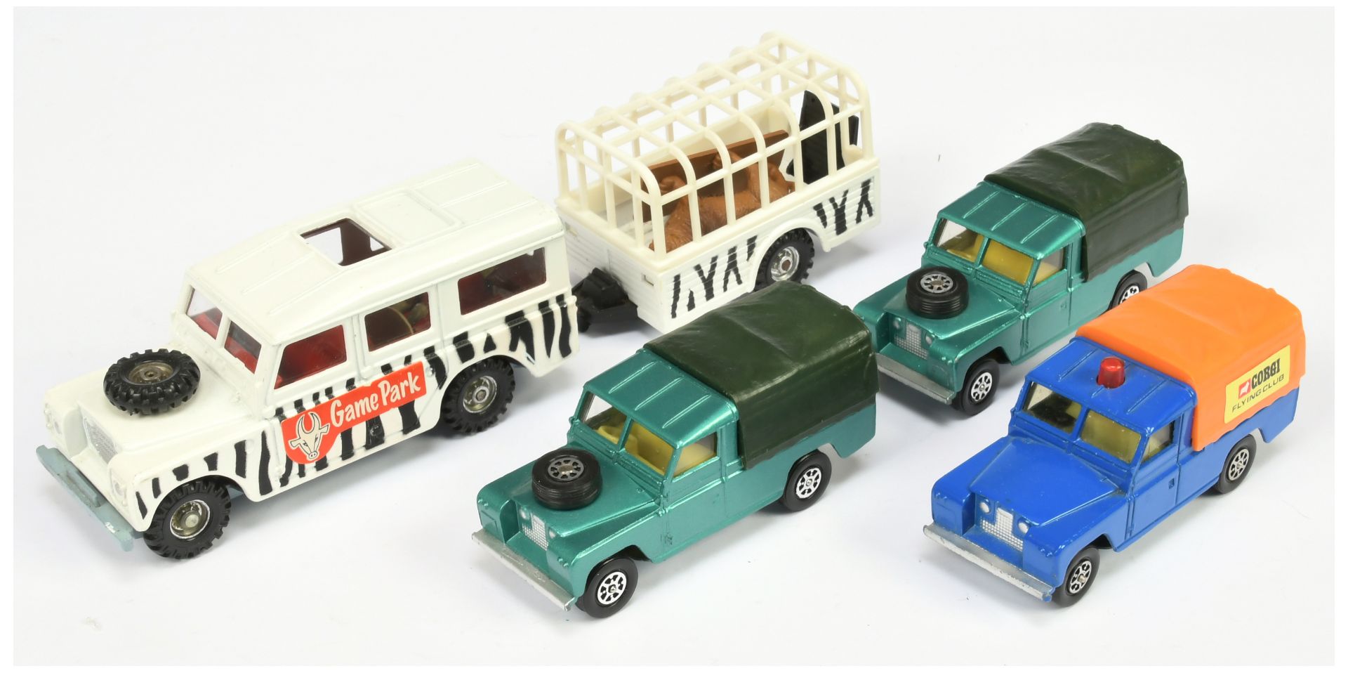 Corgi Toys Unboxed Whizzwheels Group Of 4 Land Rovers To Include (1) Blue Body, orange plastic ca...