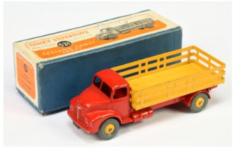 Dinky toys 531 Leyland Comet Lorry - Red cab and chassis, yellow stake back and rigid hubs with g...