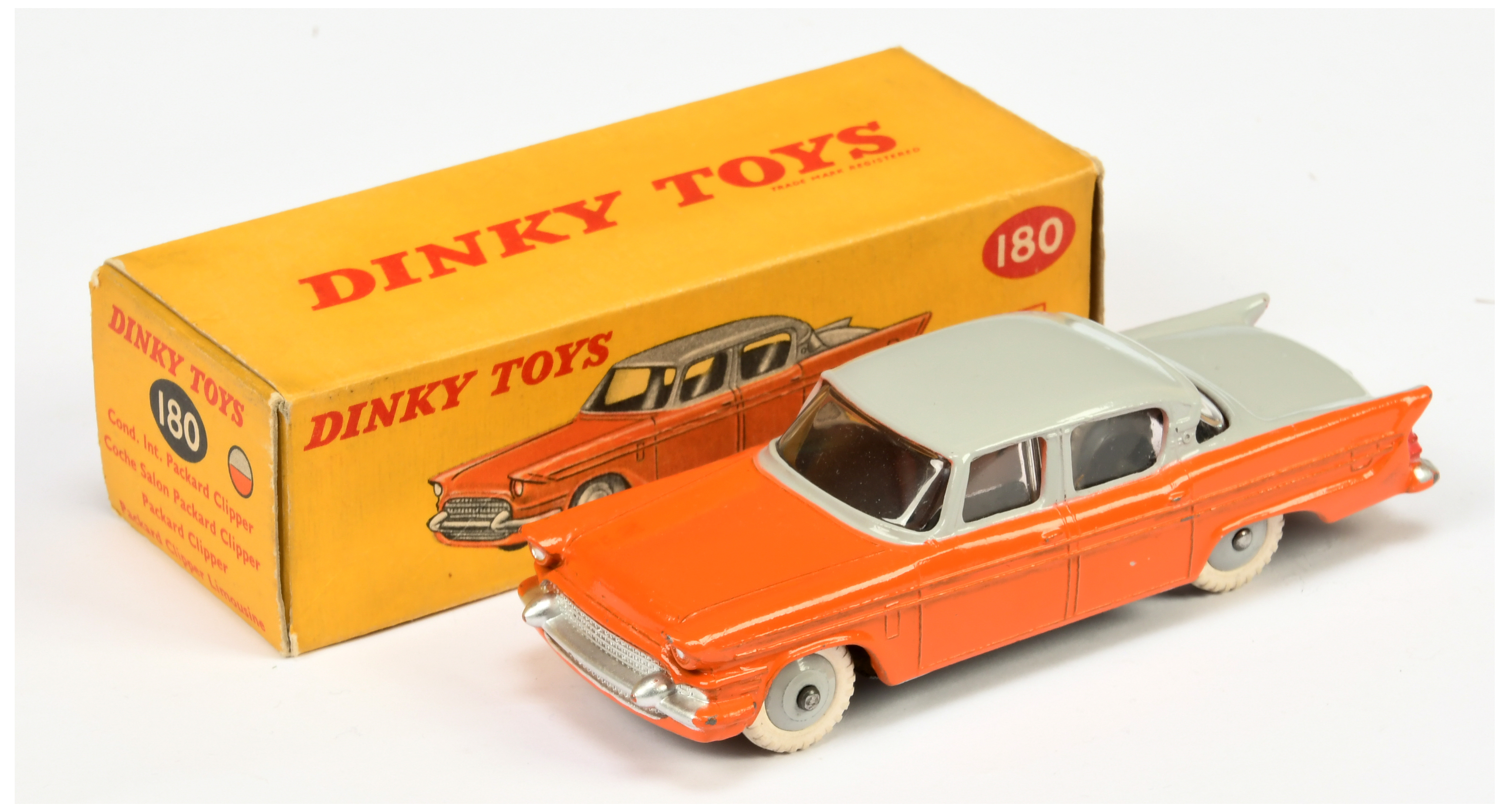 Dinky Toys 180 Packard Clipper Sedan - Two-Tone orange and grey including rigid hubs with white t...